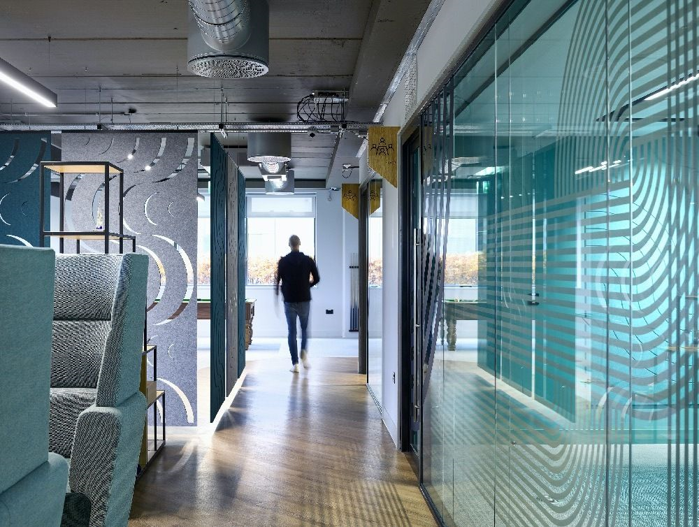 glass partitioning with person in an office