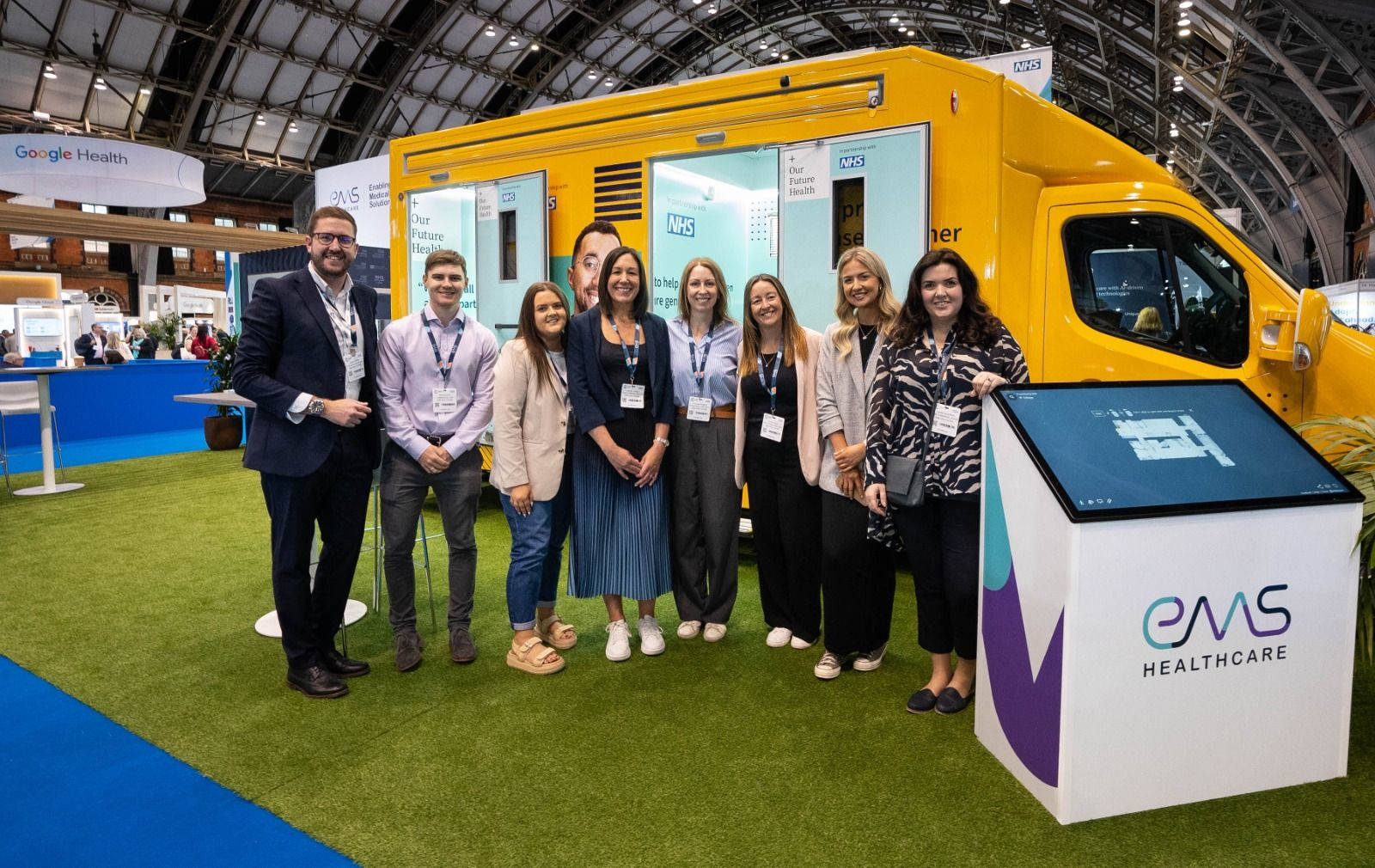people standing in front of an ambulance