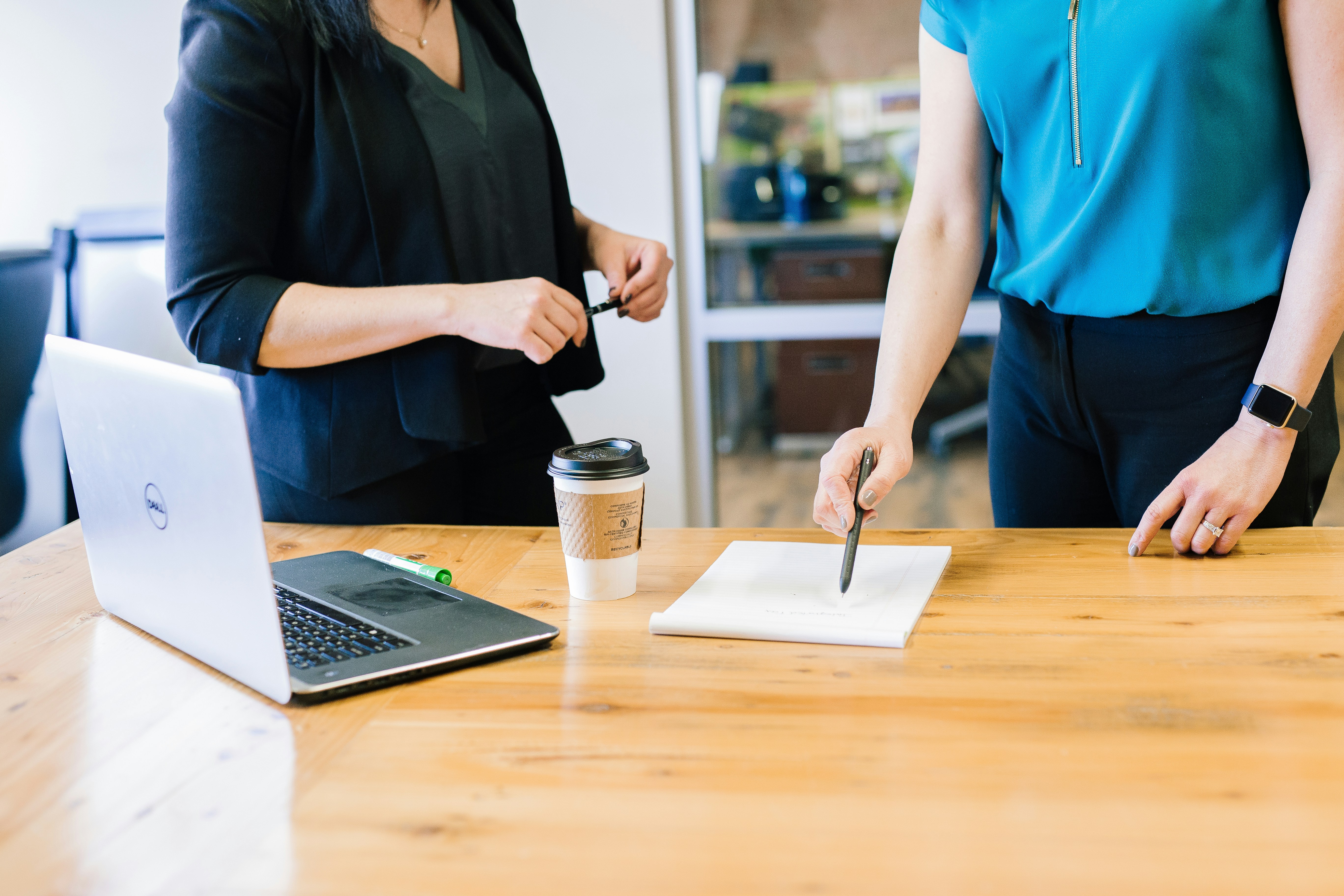 mid shot of two women having a meeting